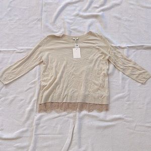Joie ivory sweater with lace trim bottom.